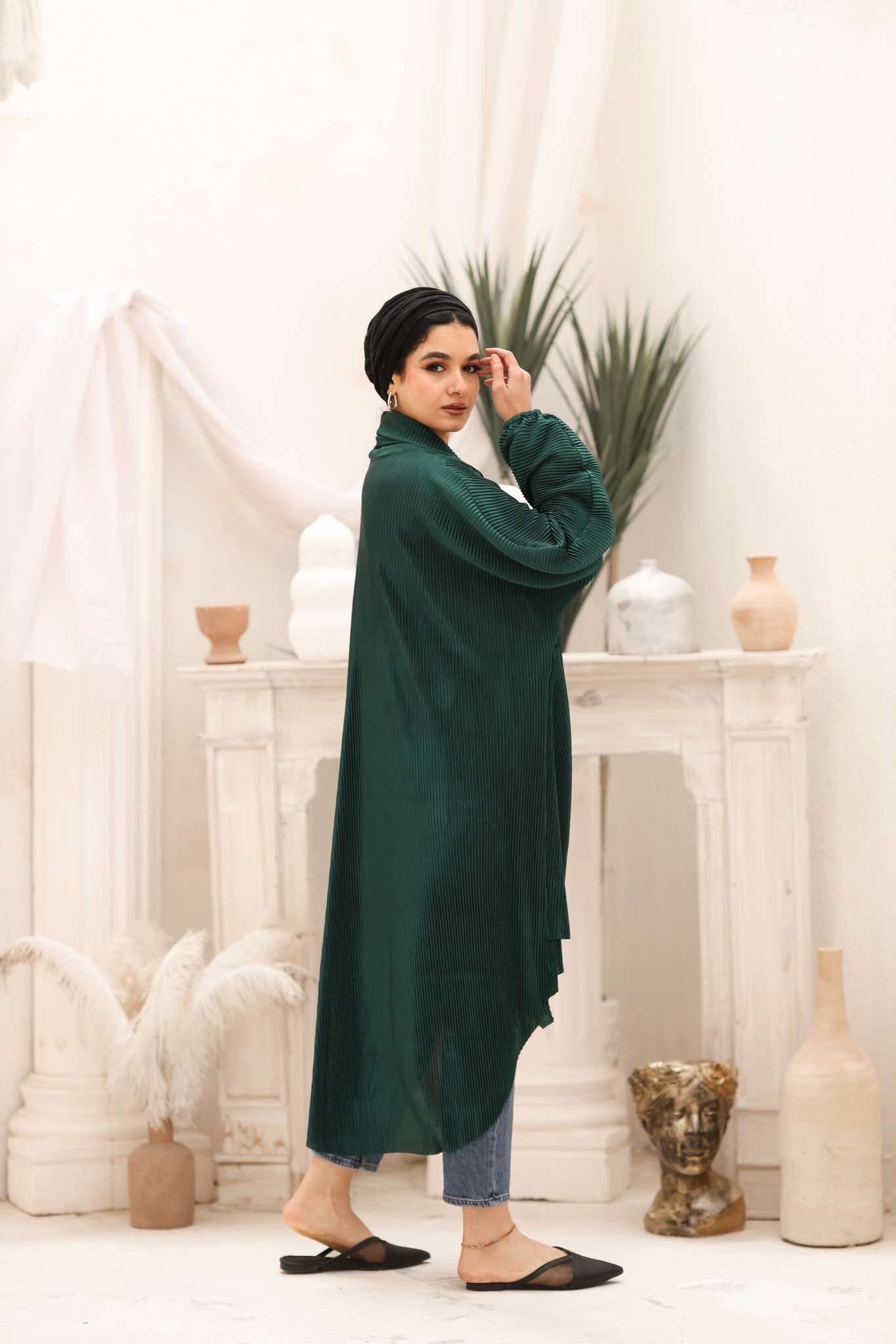 emerald green kimono dress Our Lotta Green Kimono is made from a beautiful emerald green jacquard satin., It features an adjustable belt, pockets, and we've styled it with pearls - our Andromeda necklace and Oriana earrings
